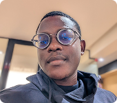 Saviour Inyang, close-up portrait wearing glasses